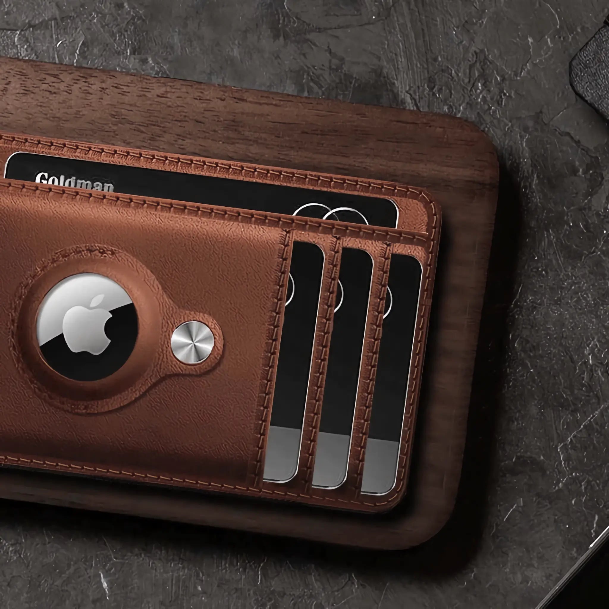 Minimify Slim AirTag Wallet in Saddle Brown premium leather on table with cards.